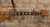 Capo fastened to the strings on the fretboard